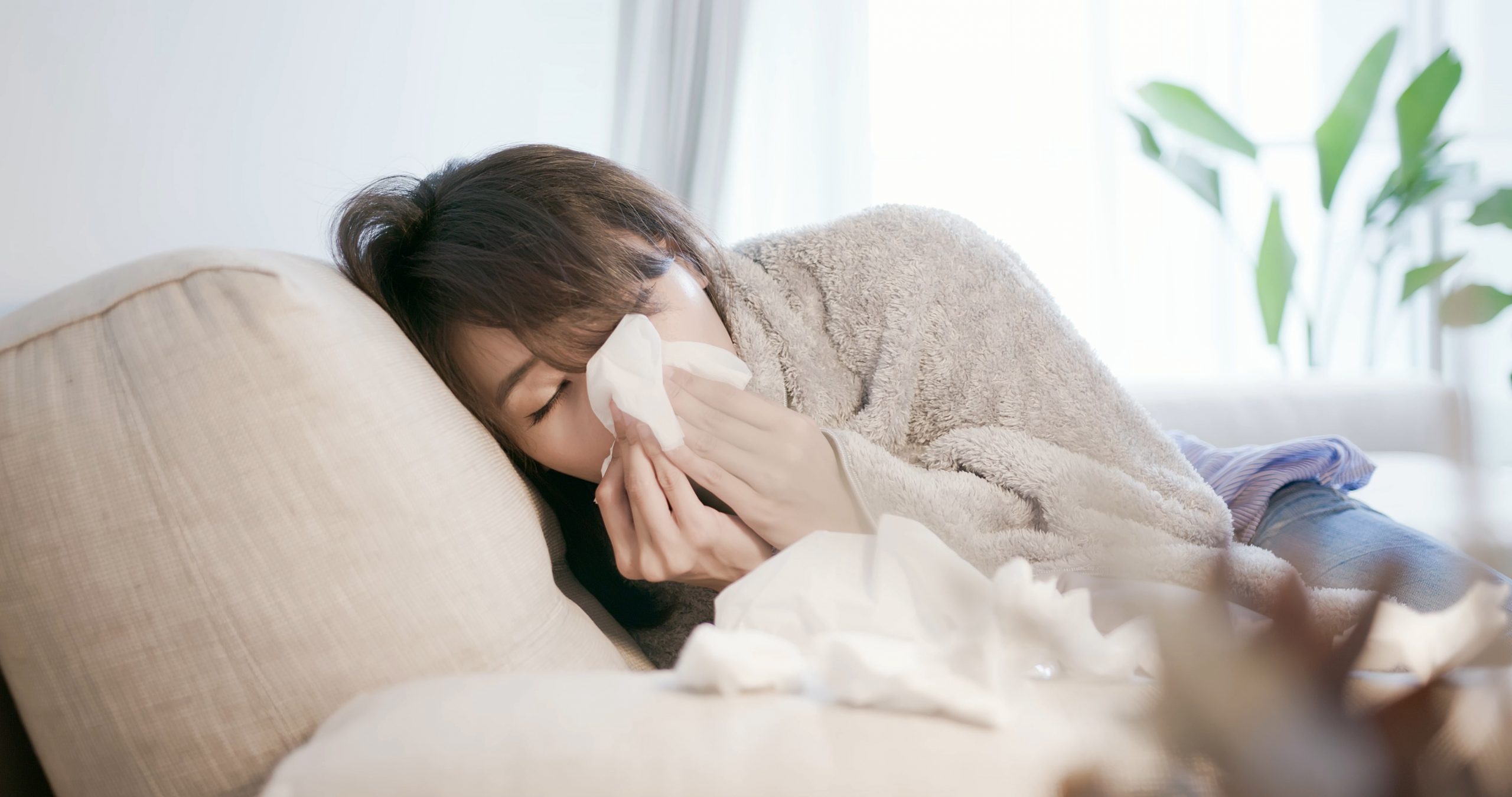 Flu or Cold. Sneezing Woman Sick Blowing Nose