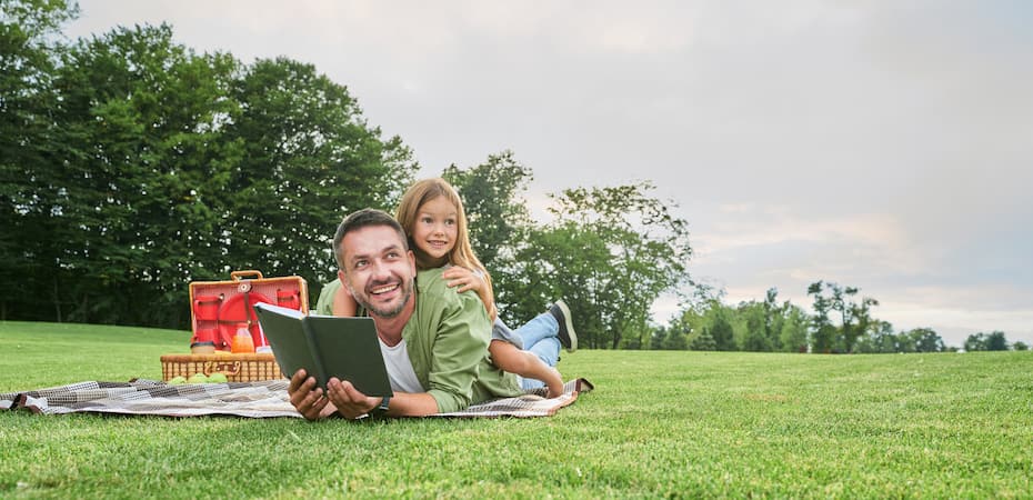 Happy mother, father and daughter in the park